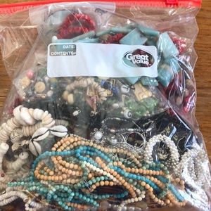 Gallon bag of stones and broken jewelry beads.